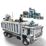 A toy truck with a building on top is constructed from interlocking bricks.