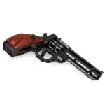 A toy gun with a brown handle and black barrel, made of interlocking plastic bricks.