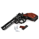 A toy gun with black and brown pieces, plus three silver bullets and two brown pieces.