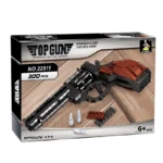 A toy gun made of interlocking bricks is displayed on its packaging, along with two small brick plates and two toy bullets.