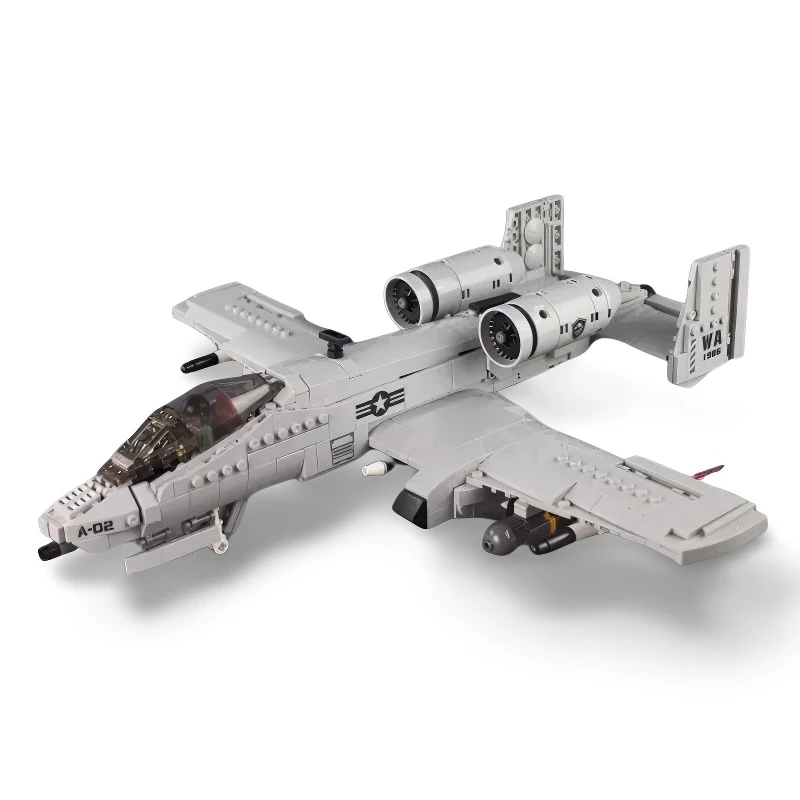 A gray toy airplane with two engines and a cockpit is visible.