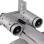 A gray brick toy airplane with two round engines is visible.