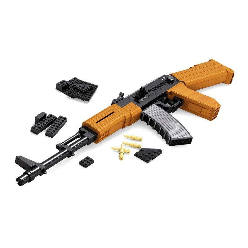 A toy gun made of interlocking bricks and some loose bricks and bullets.