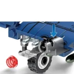 A blue toy vehicle with a wheel and a red translucent piece is depicted.
