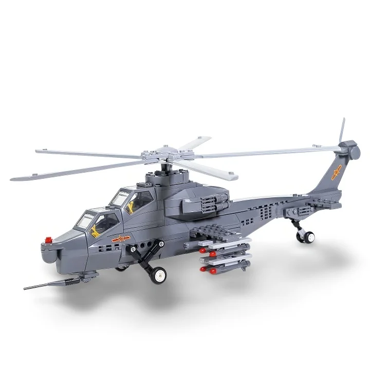 Gray toy helicopter with rotating blades and red missiles attached.