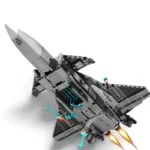 A gray toy jet with missiles and flames coming from the engines.