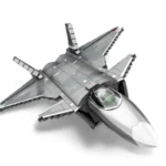 A gray toy jet with a camouflage pattern has a cockpit and multiple wings.