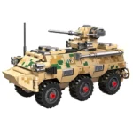 A tan and green camouflage toy military vehicle with six black wheels and a turret.