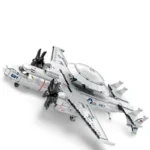 A white toy airplane with black propellers and navy markings is shown.