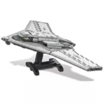 A gray toy spaceship model sits on a black stand.