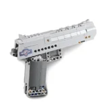A gray toy gun constructed from interlocking blocks is displayed.