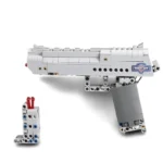 A gray toy gun and a small rectangular block are visible.