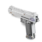 A gray toy gun constructed from interlocking blocks is visible.