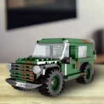 Green toy car with a license plate and large tires.