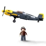 A toy airplane with yellow and gray colors and a toy pilot figure are displayed.