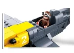 A toy airplane with a pilot figure in the cockpit.