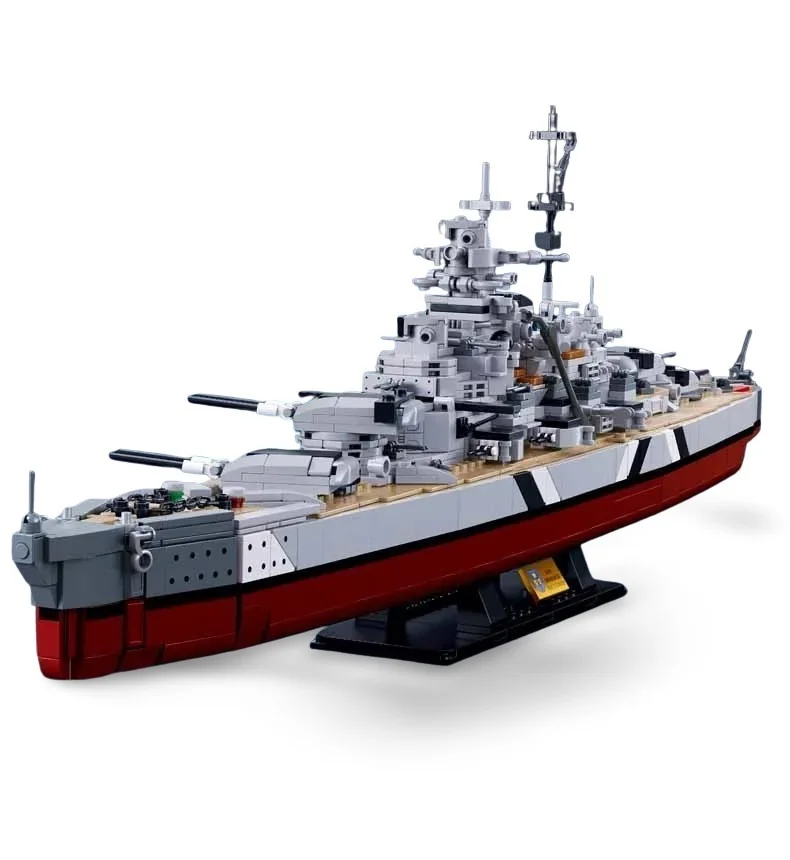 A gray and red brick built battleship model rests on a black stand.