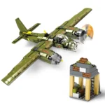A green toy airplane with rotating propellers and a small building made of toy bricks.