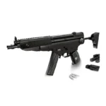 A black toy gun with a magazine, three bullets, and two small brick pieces are displayed.
