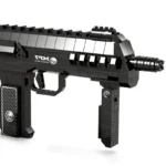 A black toy assault rifle with a textured handle and a round barrel is displayed.