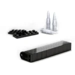 Black building bricks and three silver toy bullets.