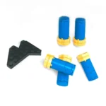 A black angular brick and four blue cylindrical bricks with yellow accents are visible.