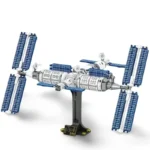 A toy space station with solar panels and a black stand.