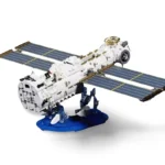A white space station model with blue solar panels and a blue base.