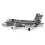 A gray toy jet with landing gear is displayed in a side profile.