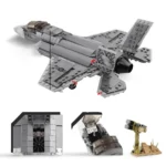 A gray toy jet with a cockpit, engine, and a separate missile launcher are displayed.