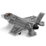 A gray toy jet airplane with black accents is displayed.