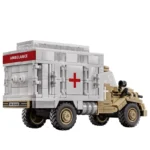 A toy ambulance truck with a red cross and the word "AMBULANCE" on its side.