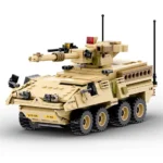 A tan toy military vehicle with a turret, multiple wheels, and black antennas.