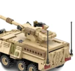 A tan toy tank with a long cannon and six wheels.