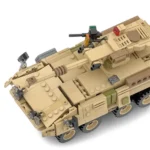 A tan toy tank with multiple wheels, a cannon, and other attached elements.