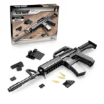 A black toy assault rifle with a box and loose pieces is displayed.