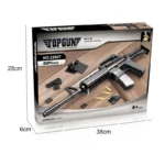 A box displays a toy gun with several small black and yellow pieces.
