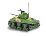 Green toy tank with rotating turret, treads, and mounted weapons.