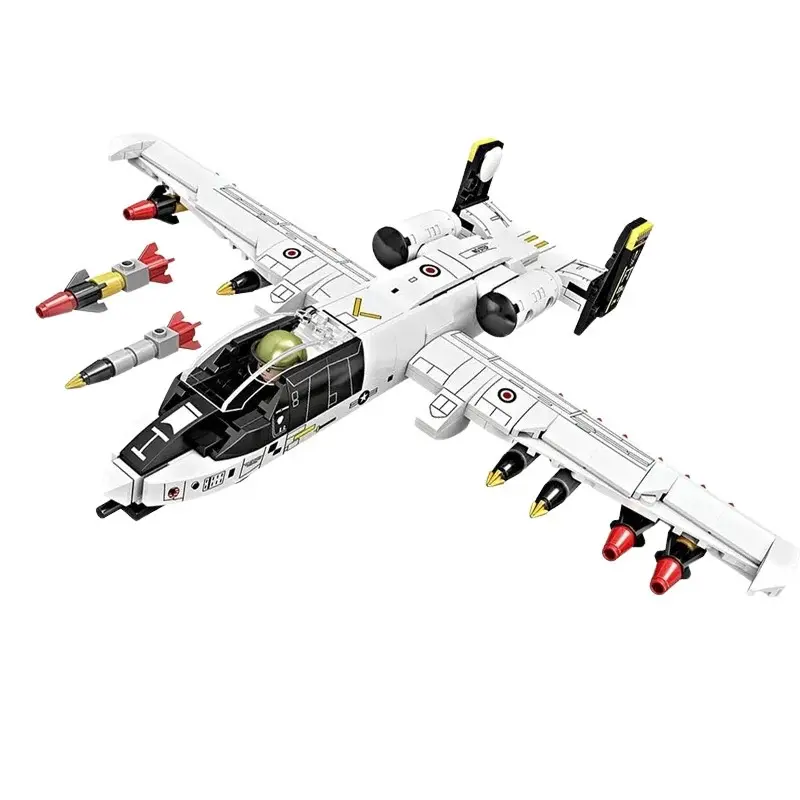 A white toy airplane with black and red missiles is displayed.