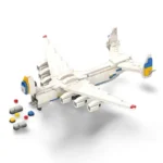 A toy airplane constructed from interlocking bricks with blue and yellow accents, and several small gray, red, and yellow bricks are nearby.