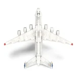 White toy airplane with red and blue accents, viewed from above.