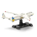 A white and blue toy airplane is on a black stand.