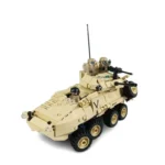 A tan brick vehicle with three figures and a mounted weapon.