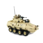 A tan toy military vehicle with three figures and multiple guns.
