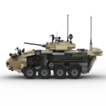 A tan and gray toy military vehicle with six wheels and a turret is shown.