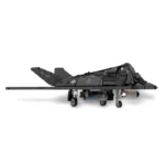 A black brick-built model of a stealth aircraft with wheels and a long thin boom is displayed.