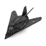 Black stealth aircraft toy with a star symbol on the wings.