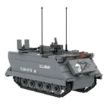 Gray toy military vehicle with tracks, two antennas, a shovel, and skull graphic.