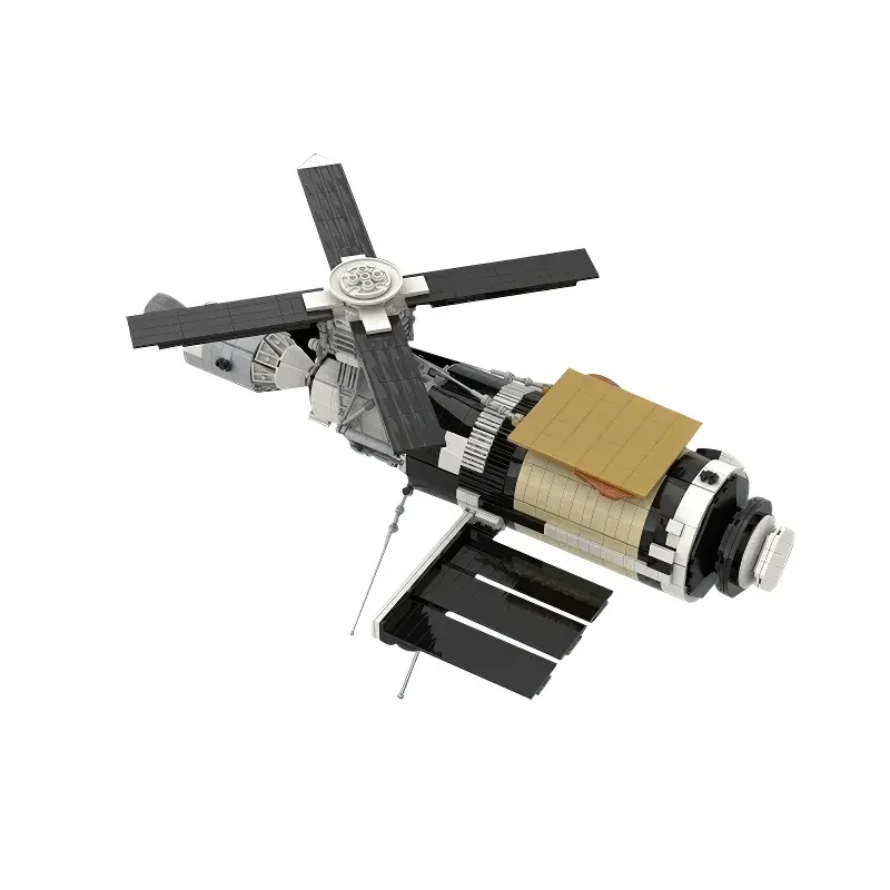A toy space station with black solar panels and a central cylindrical body.