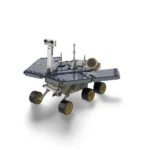 A gray and tan toy rover with six wheels and solar panels is displayed.